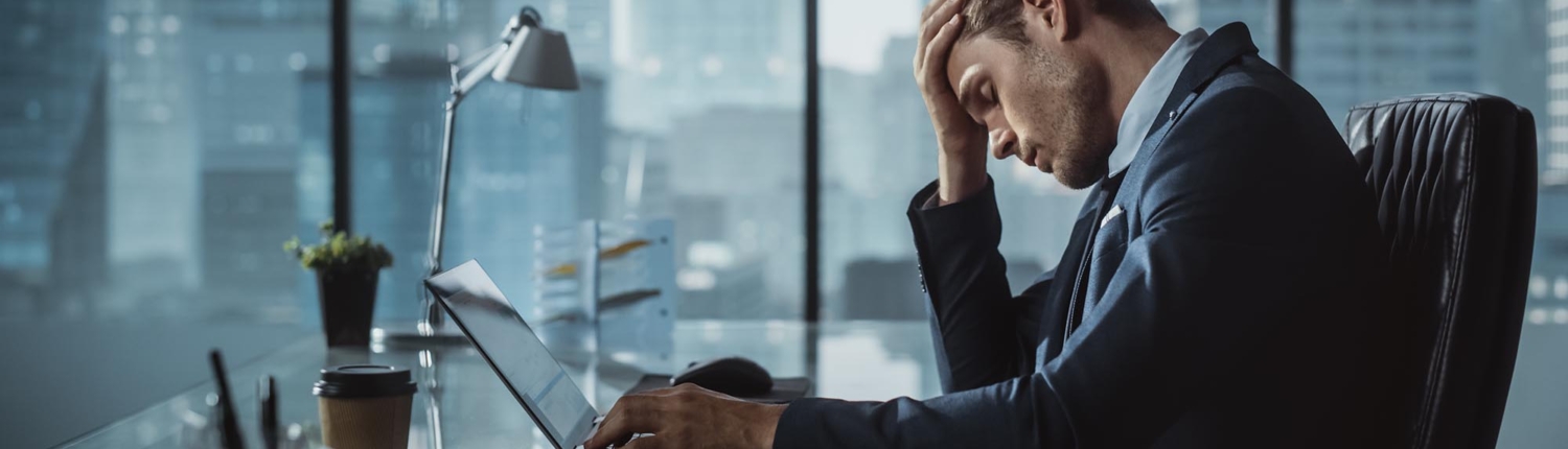 Office worker stressed at computer