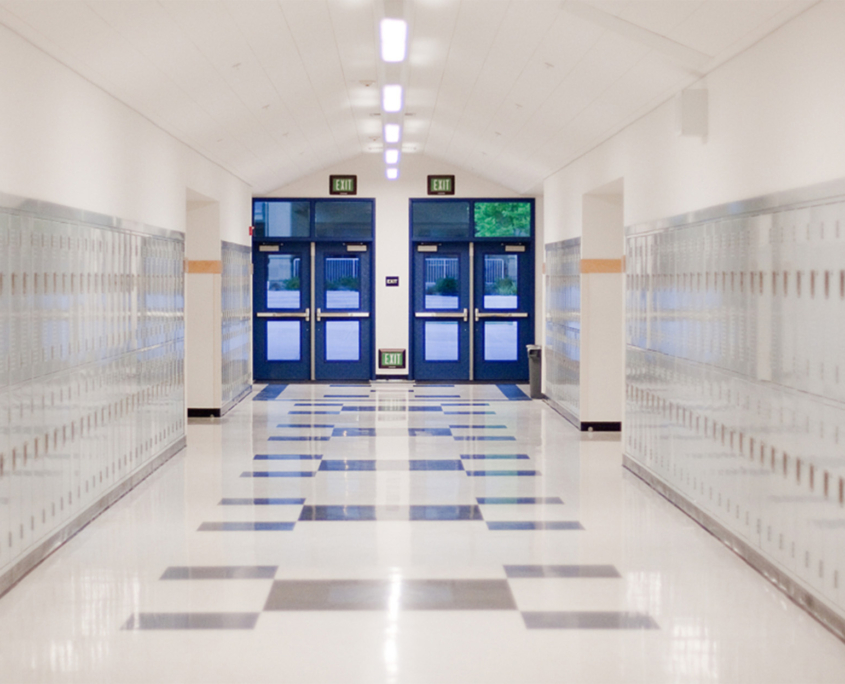 Front view of hallway doors down a school hallway