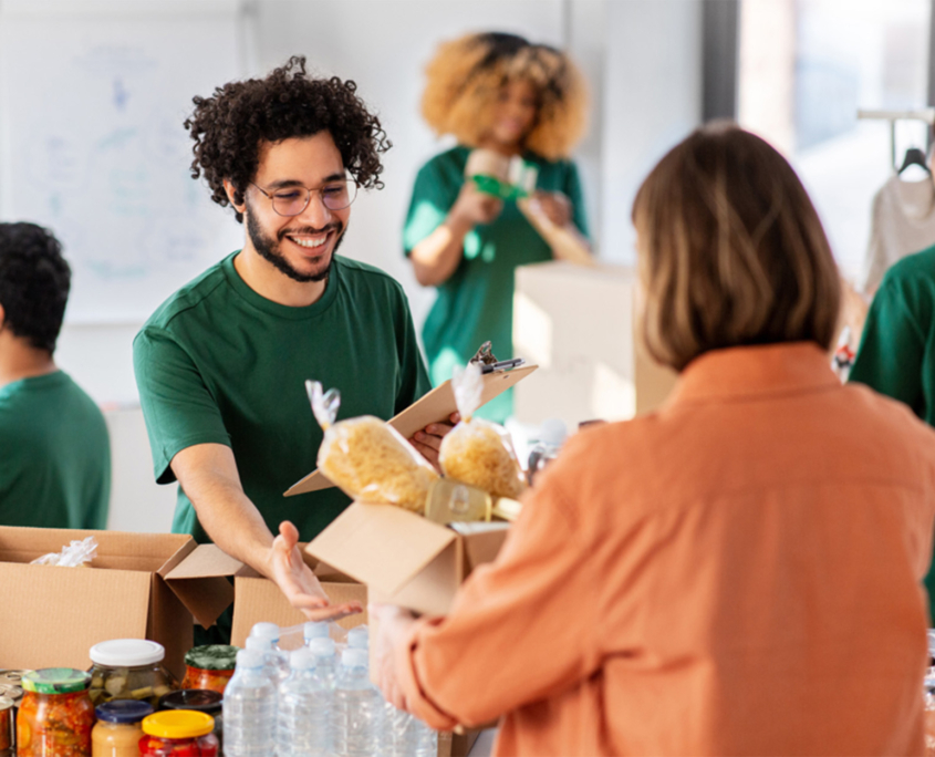 Side view of a young man working at food drive