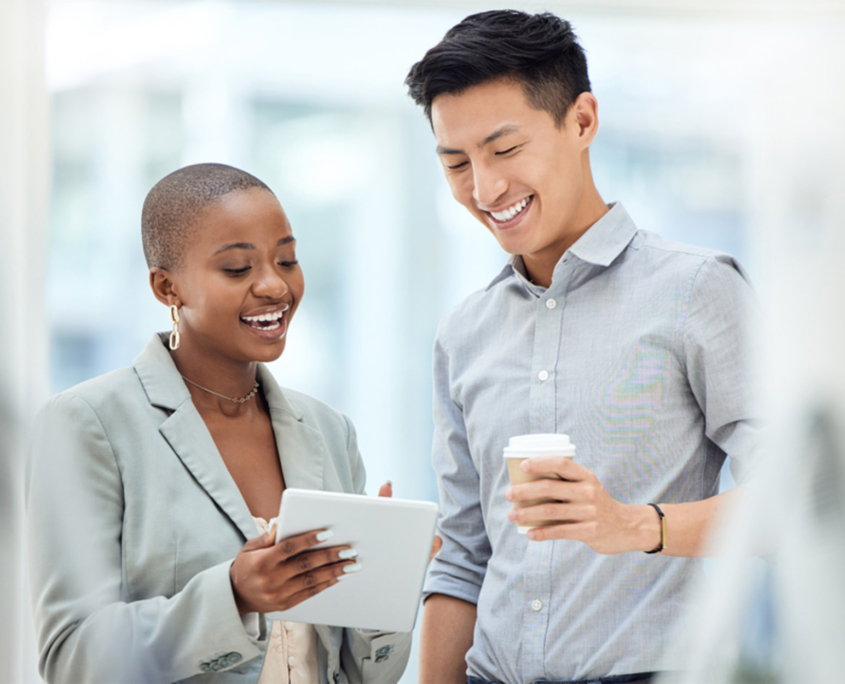 Two-Professionals-Looking-at-Tablet-in-Office
