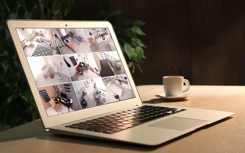 Side view of a computer with security camera footage on the screen