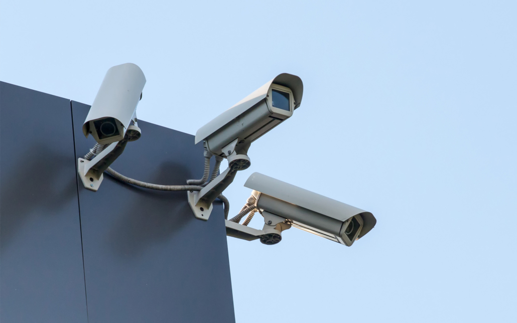 Side view of security CCTV cameras pointed in different directions on corner of building