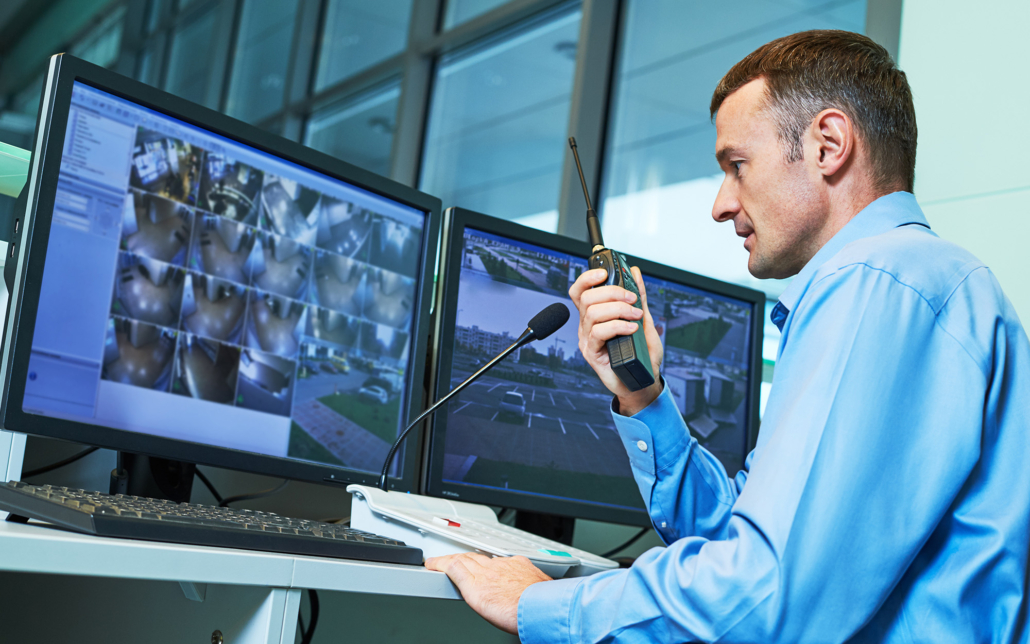 Security worker during monitoring. Video surveillance system