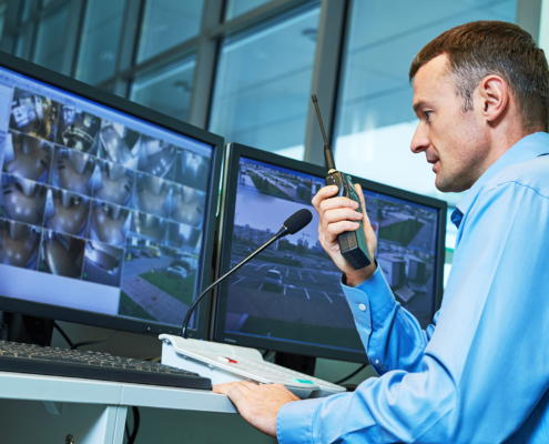 Security worker during monitoring. Video surveillance system