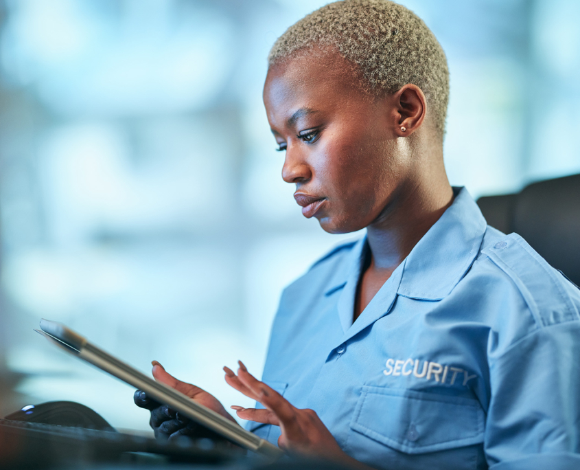 Security, working and black woman with tablet at a desk for communication
