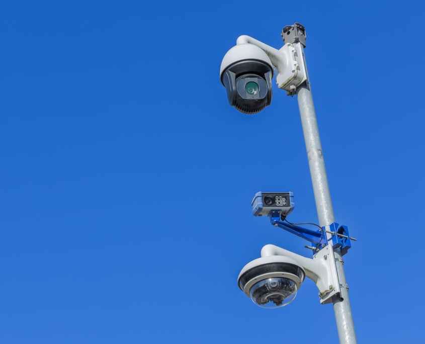 Three surveillance cameras on a pole, a high resolution camera