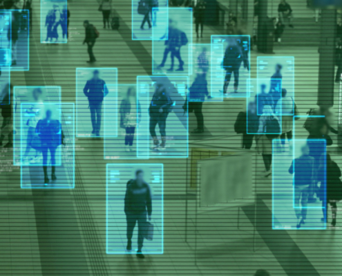 Scanning the crowd of people walking at the railway station