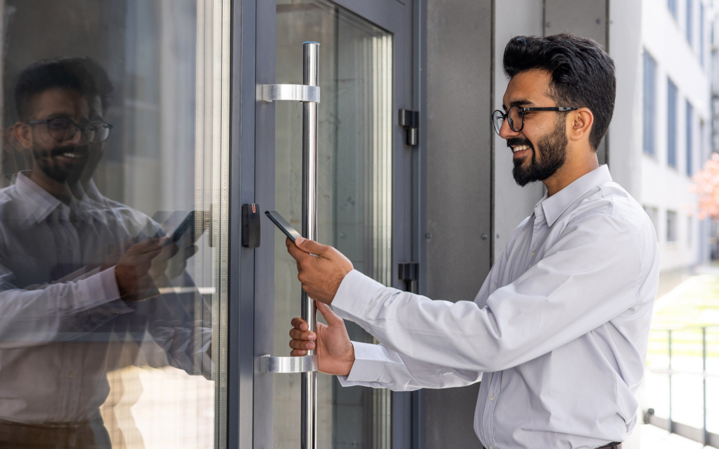 worker unlocks door with phone