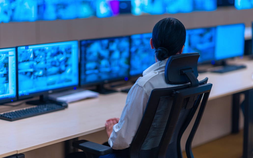 security guard monitors video feed